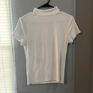 white knitted turtle neck